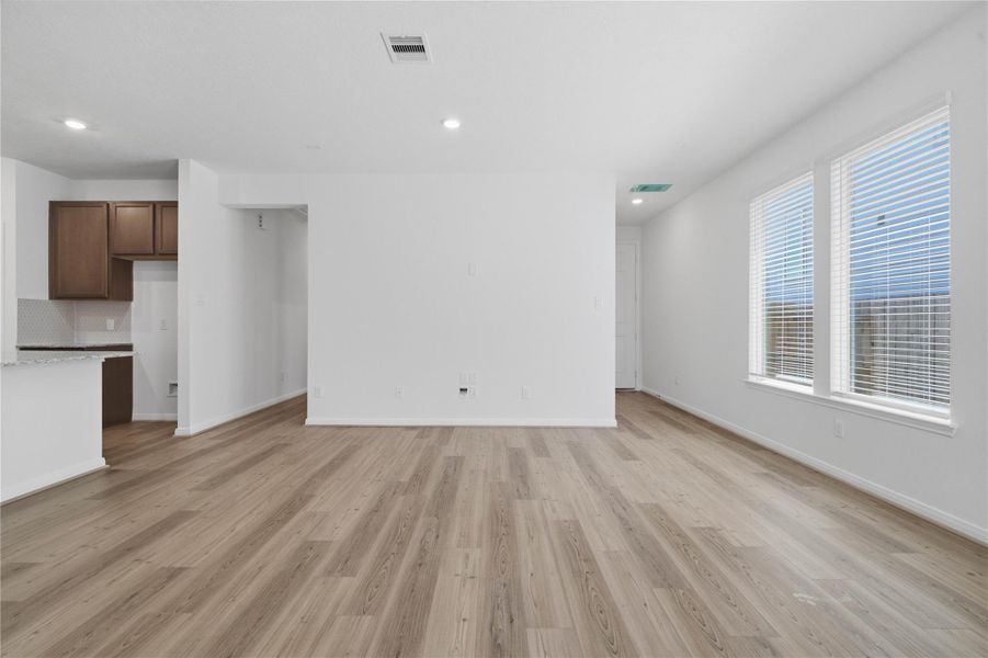 Create lasting memories with family and friends in this inviting dining room! It showcases high ceilings, recessed lighting, custom paint, and stunning viny plank flooring. Create lasting memories with family and friends in this inviting dining room! It showcases high ceilings, recessed lighting, custom paint, and stunning viny plank flooring.