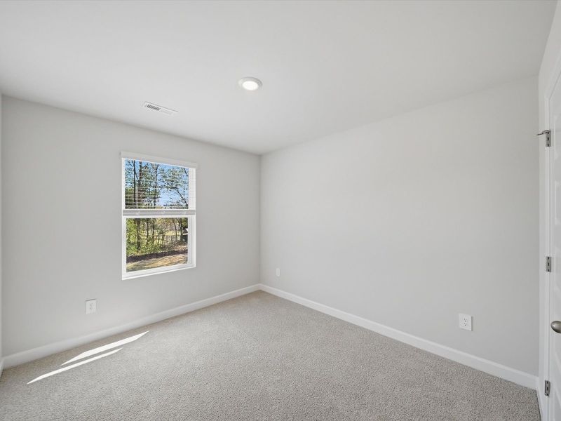 Spacious, unfurnished interior of a new home in Crossing at Abner Creek Townes, Greer (Image 18).