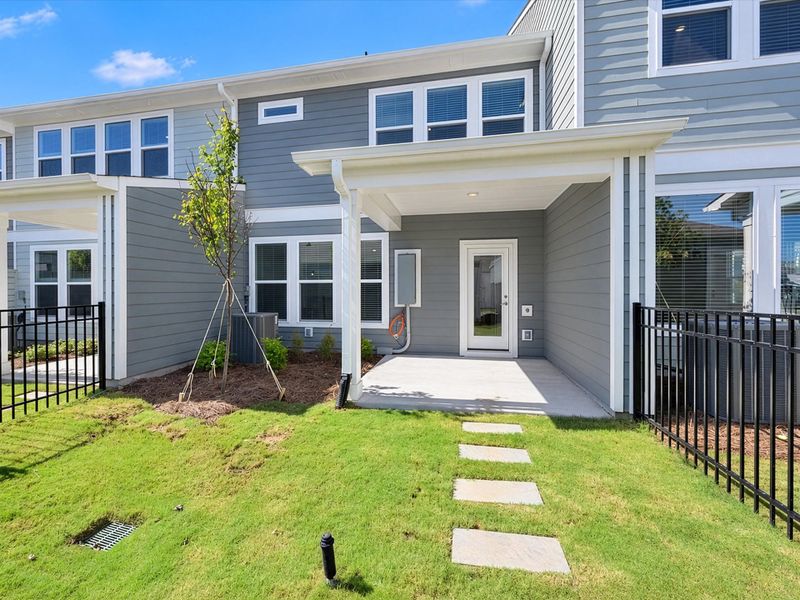 Exterior details and patio area of a home in North Creek Village - Townhomes, Huntersville (Image 3). Exterior details and patio area of a home in North Creek Village - Townhomes, Huntersville (Image 3).