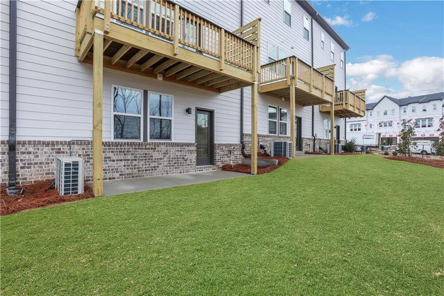 Exterior details and patio area of a home in Towne Village at Suwanee Dam, Sugar Hill (Image 27). Exterior details and patio area of a home in Towne Village at Suwanee Dam, Sugar Hill (Image 27).