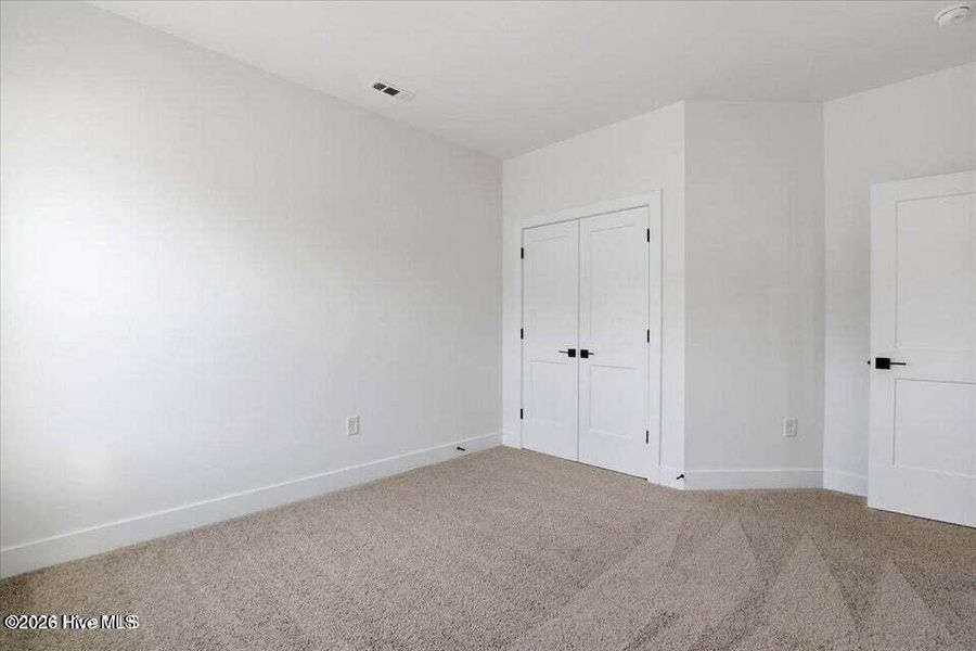 Spacious, unfurnished interior of a new home in Wood Creek Landing, Leland (Image 23). Spacious, unfurnished interior of a new home in Wood Creek Landing, Leland (Image 23).