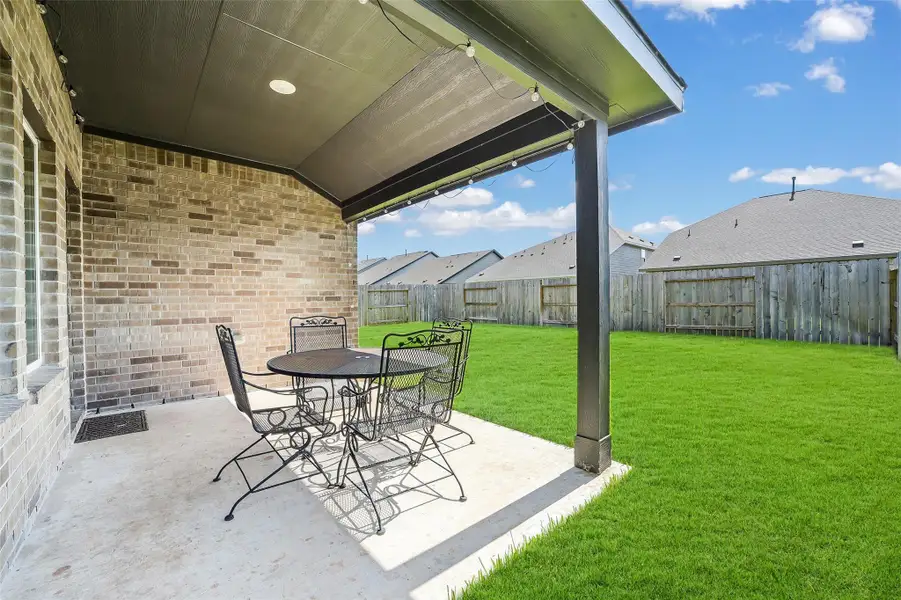 Exterior details and patio area of a home in Sunterra, Katy (Image 3). Exterior details and patio area of a home in Sunterra, Katy (Image 3).