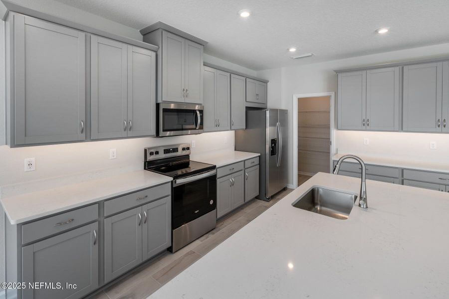 Furnished interior view inside a new home in Lakes at Bella Lago, Green Cove Springs (Image 9).