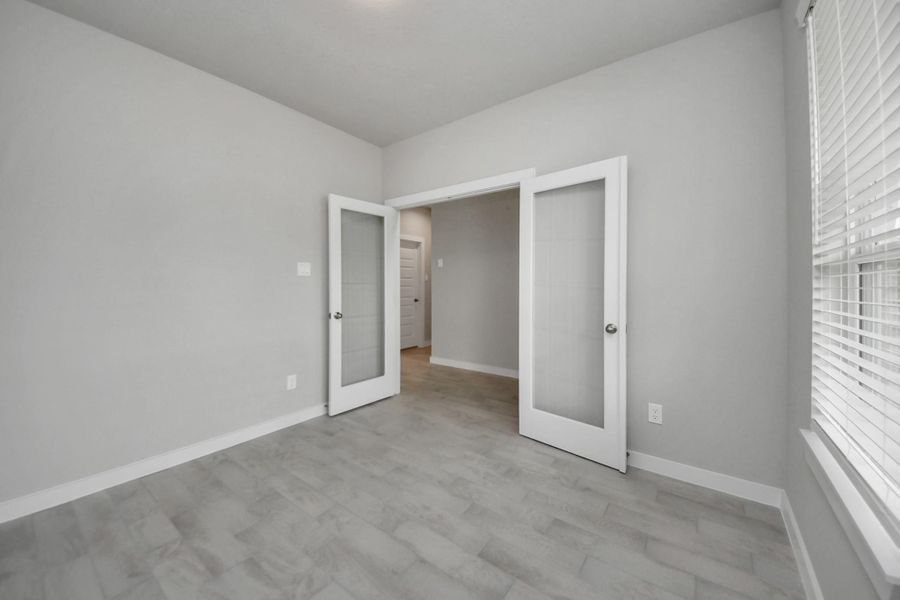 Step into the inviting home office, where elegant tile flooring adds a touch of freshnessand comfort to the workspace. Natural light pours through the window, creating aninspiring environment for productivity and focus. Sample photo of completed home with similar floor plan. Actual colors and selections may vary. Step into the inviting home office, where elegant tile flooring adds a touch of freshnessand comfort to the workspace. Natural light pours through the window, creating aninspiring environment for productivity and focus. Sample photo of completed home with similar floor plan. Actual colors and selections may vary.
