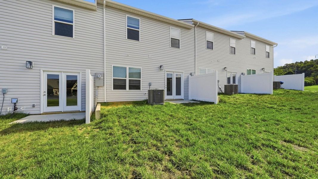 Exterior details and patio area of a home in The Arbor Townhomes, Kingsport (Image 3).