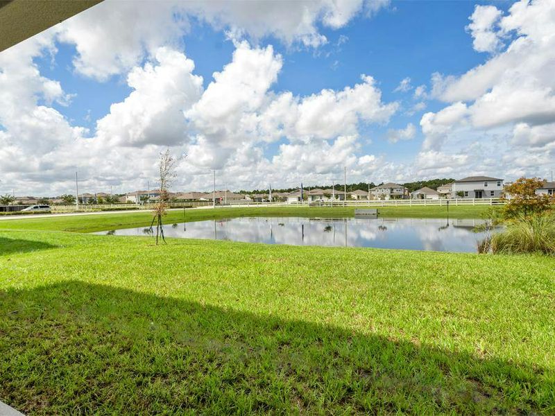 Situated on a pond, enjoy backyard privacy and peaceful water views.