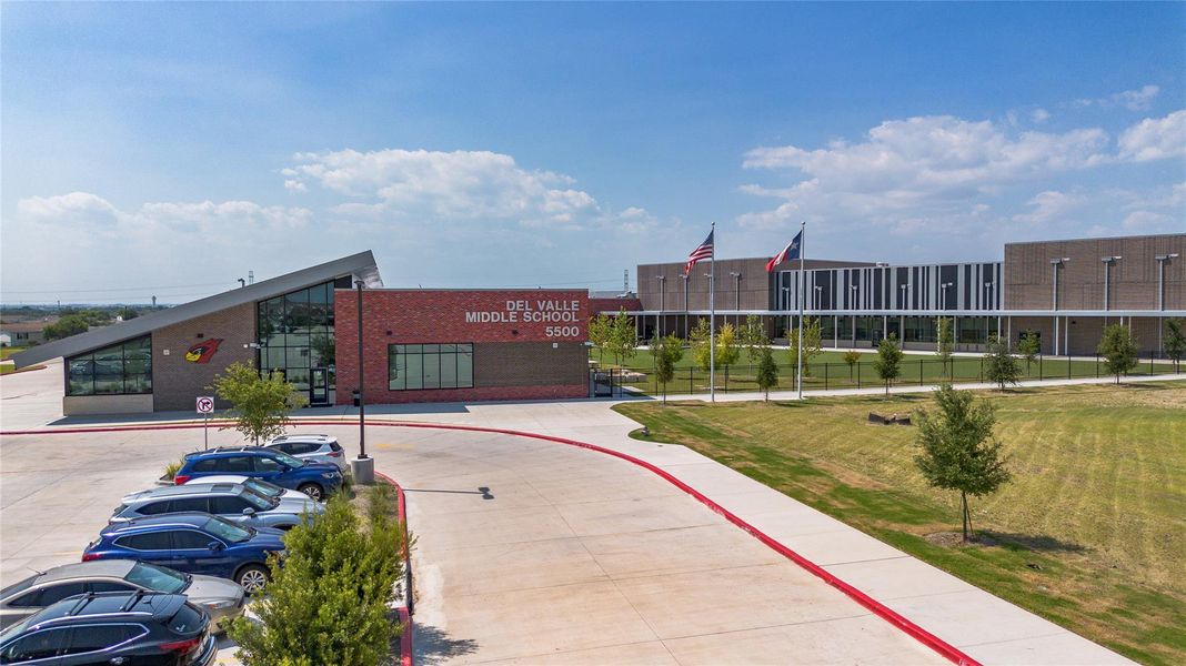 View of property featuring uncovered parking View of property featuring uncovered parking
