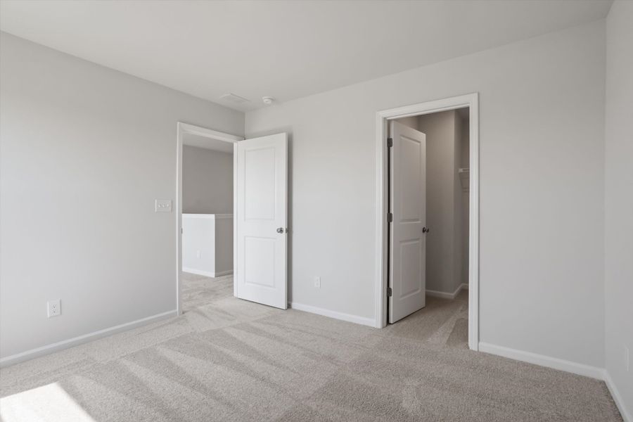 Spacious, unfurnished interior of a new home in Cambridge Reserve, Angier (Image 28).