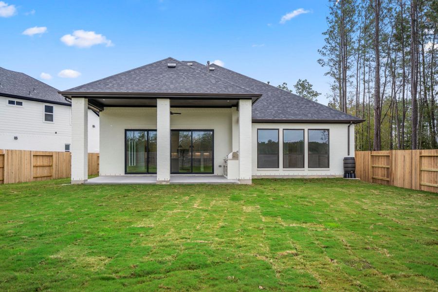 Exterior details and patio area of a home in ARTAVIA 55' Lots, Conroe (Image 29). Exterior details and patio area of a home in ARTAVIA 55' Lots, Conroe (Image 29).