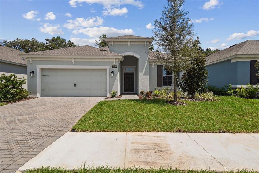 Front exterior of a new home in Cascades at Southern Hills, Brooksville, FL, highlighting curb appeal (Image 23).