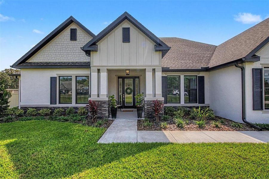 Front exterior of a new home in , Hudson, FL, highlighting curb appeal (Image 1). Front exterior of a new home in , Hudson, FL, highlighting curb appeal (Image 1).