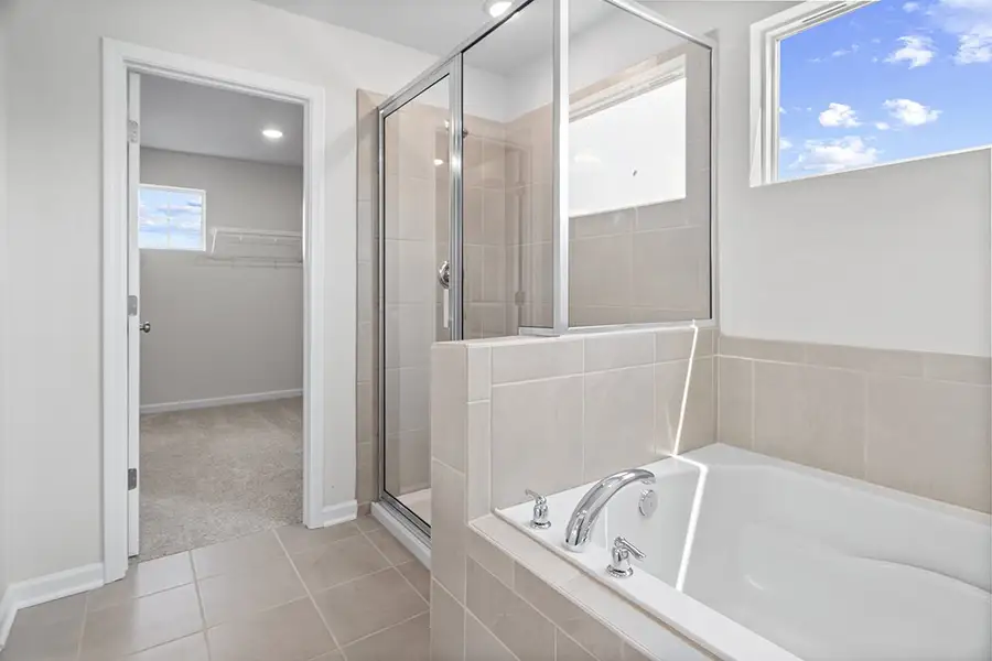 A bathroom with a glass shower. A bathroom with a glass shower.