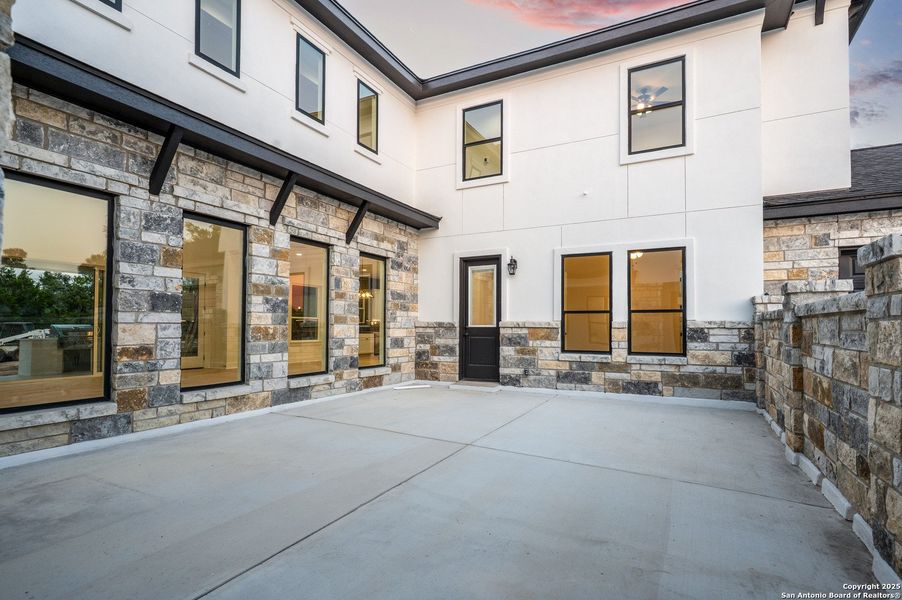 Front exterior of a new home in , New Braunfels, TX, highlighting curb appeal (Image 1).