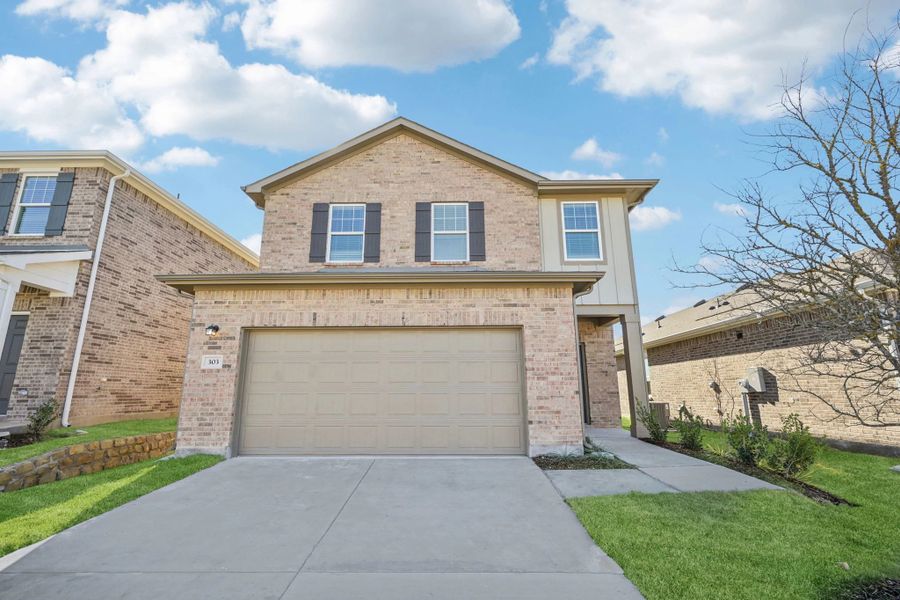 Front exterior of a new home in Windmill Farms, Forney, TX, highlighting curb appeal (Image 1). Front exterior of a new home in Windmill Farms, Forney, TX, highlighting curb appeal (Image 1).