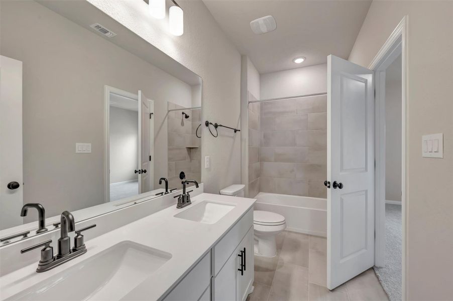 Furnished interior view inside a new home in Heritage, Dripping Springs (Image 6).