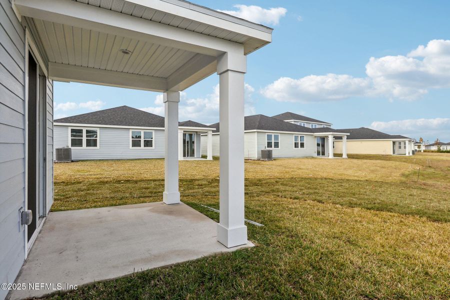 Front exterior of a new home in Lakes at Bella Lago - Signature Series, Green Cove Springs, FL, highlighting curb appeal (Image 17).