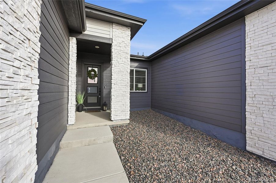 Exterior details and patio area of a home in Hilltop at Inspiration, Aurora (Image 22).