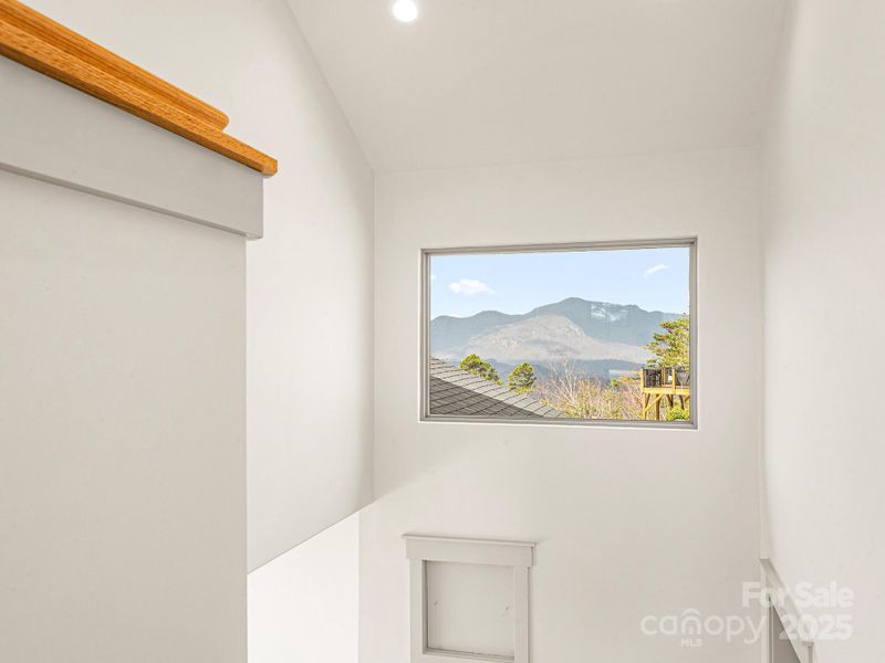 staircase with picture framed view window