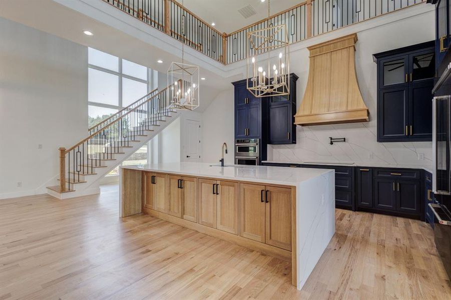Open-concept living area with light wood-finish flooring