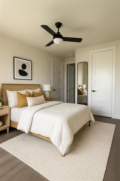 Bedroom with wood finished floors and ceiling fan Bedroom with wood finished floors and ceiling fan