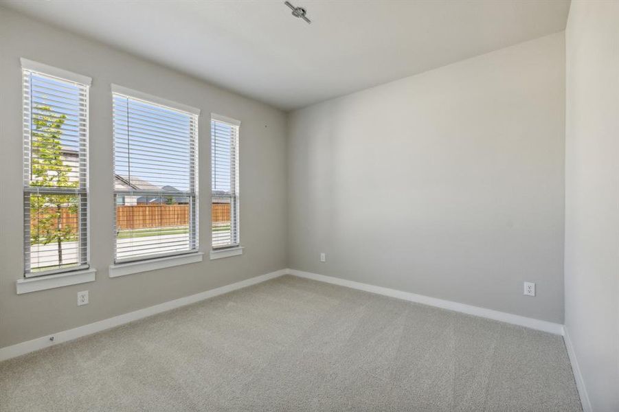 Bedroom in the Masters home plan by Trophy Signature Homes – REPRESENTATIVE PHOTO