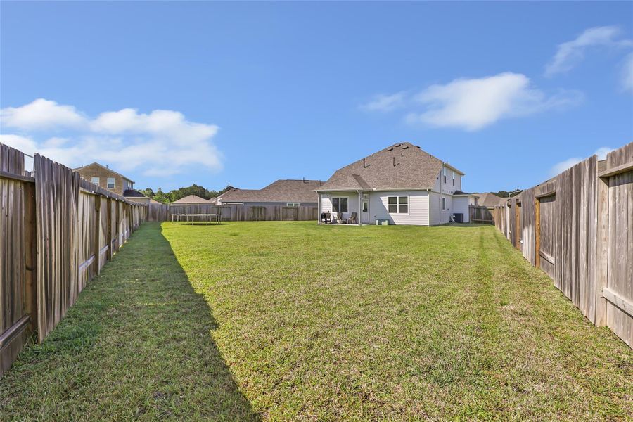 Exterior details and patio area of a home in Granger Pines, Conroe (Image 25).