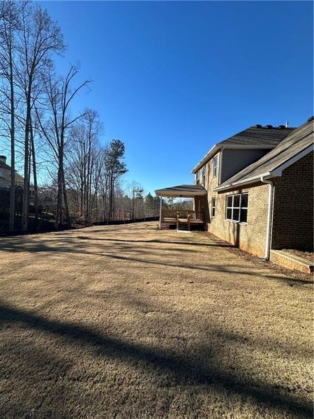 Exterior details and patio area of a home in Mirror Lake at South Harbour, Villa Rica (Image 25).