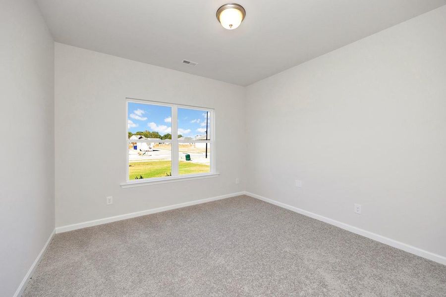 The Avery- Secondary Bedroom. Home under construction. Sample floor plan photo used for illustrative purposes only. Upgrades, selections options, and colors will vary.