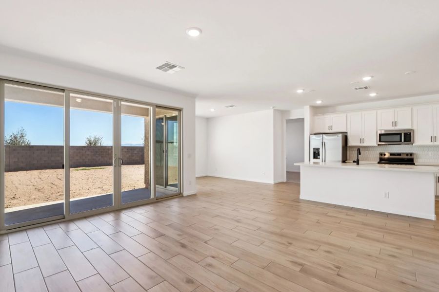 Great room and kitchen. Not actual home, finishes may vary by community. Great room and kitchen. Not actual home, finishes may vary by community.