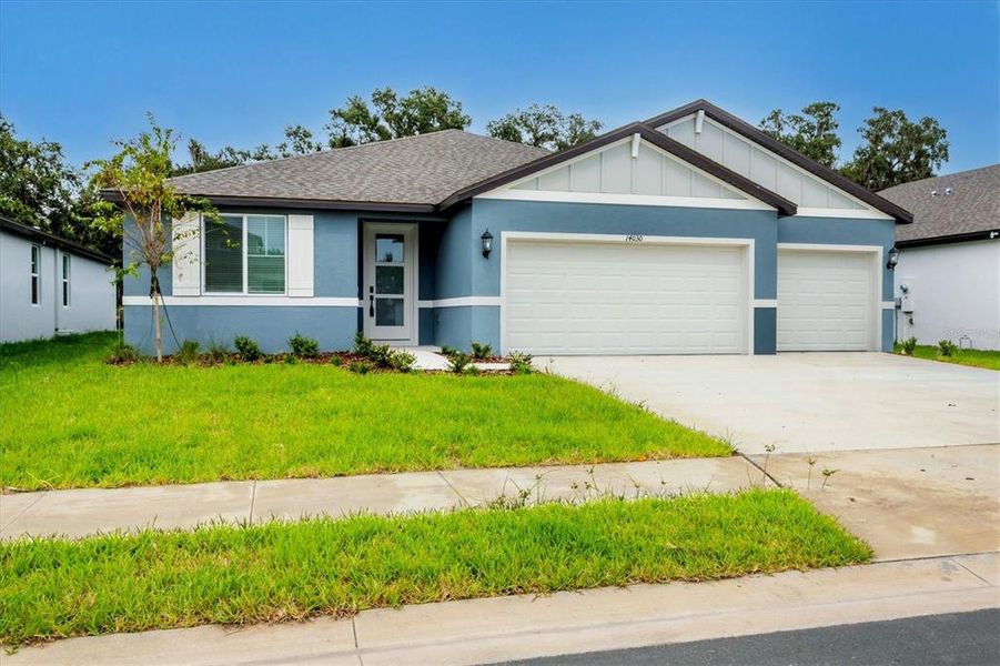 Front exterior of a new home in , Parrish, FL, highlighting curb appeal (Image 21).