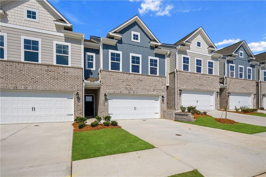 Front exterior of a new home in Langley Overlook, Loganville, GA, highlighting curb appeal (Image 17).