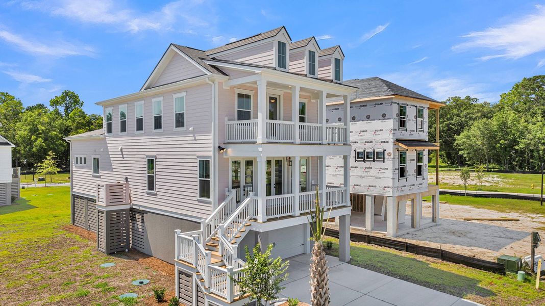 Front exterior of a new home in Miller's Crossing, Johns Island, SC, highlighting curb appeal (Image 20). Front exterior of a new home in Miller's Crossing, Johns Island, SC, highlighting curb appeal (Image 20).