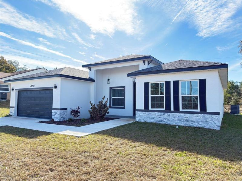 Front exterior of a new home in , Ocala, FL, highlighting curb appeal (Image 27).