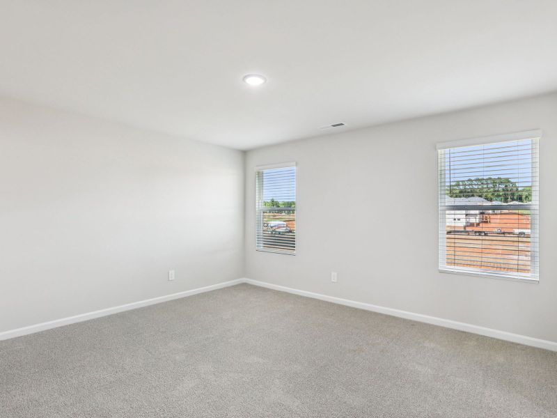 Primary bedroom in the Paisley floorplan at a Meritage Homes community in Garner, NC.