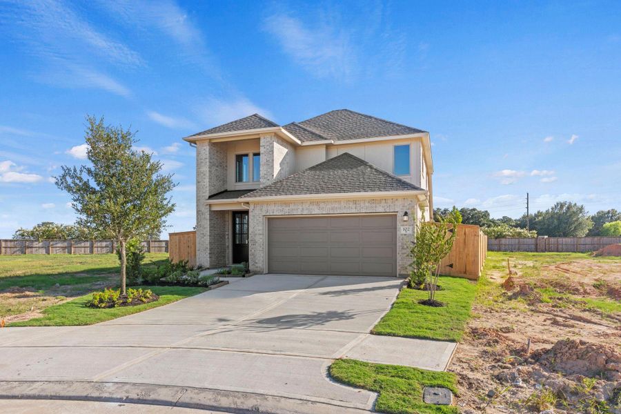 Front exterior of a new home in Candela, Richmond, TX, highlighting curb appeal (Image 24).