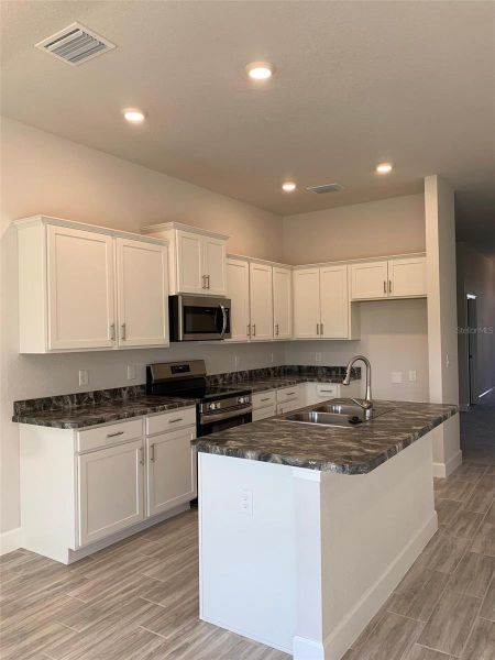 Furnished interior view inside a new home in Twisted Oaks, Beverly Hills (Image 4). Furnished interior view inside a new home in Twisted Oaks, Beverly Hills (Image 4).
