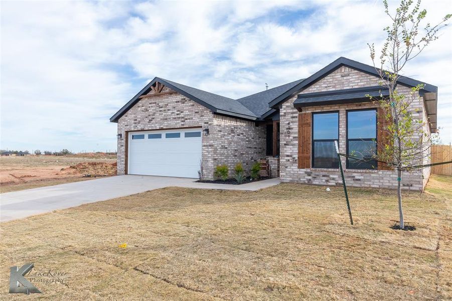 Front exterior of a new home in , Abilene, TX, highlighting curb appeal (Image 2). Front exterior of a new home in , Abilene, TX, highlighting curb appeal (Image 2).