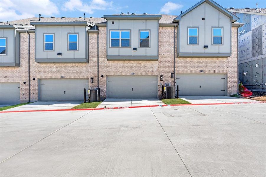 Front exterior of a new home in Hillside at Las Colinas, Irving, TX, highlighting curb appeal (Image 2).