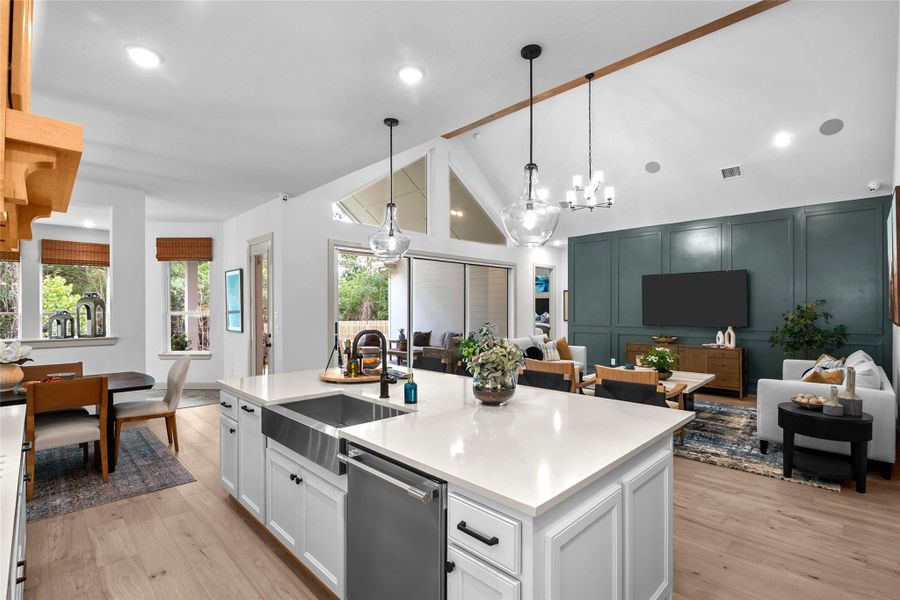 EXAMPLE PHOTO: Big island / breakfast bar. Double trash drawer. Quartz counters.