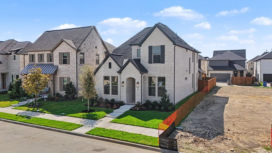 Front exterior of a new home in Light Farms Brenham - 40' Lots, Celina, TX, highlighting curb appeal (Image 22).