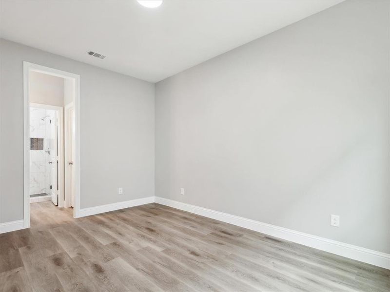 Spare room with light hardwood / wood-style flooring