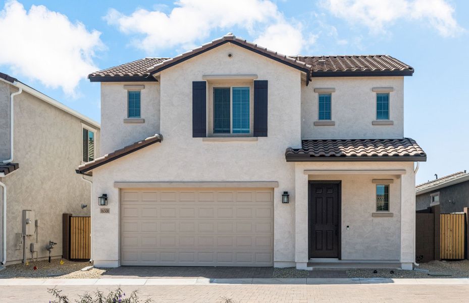 Front exterior of a new home in Asante- Atrium Series, Surprise, AZ, highlighting curb appeal (Image 21). Front exterior of a new home in Asante- Atrium Series, Surprise, AZ, highlighting curb appeal (Image 21).