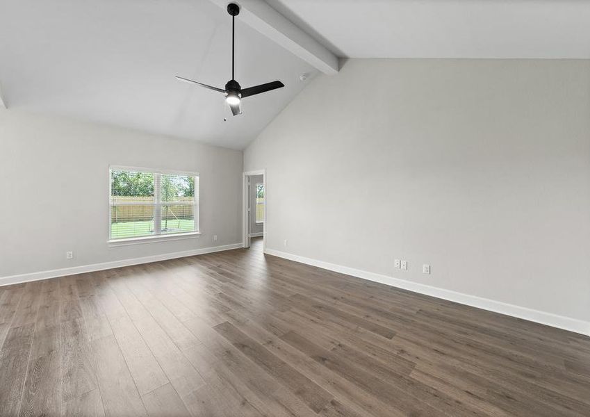 The family room of the Sabine floor plan has a large window that lets in great, natural light.