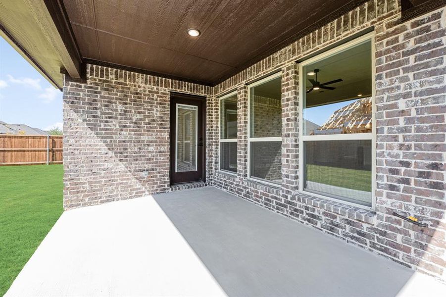 Exterior details and patio area of a home in Woodstone, Providence Village (Image 4). Exterior details and patio area of a home in Woodstone, Providence Village (Image 4).