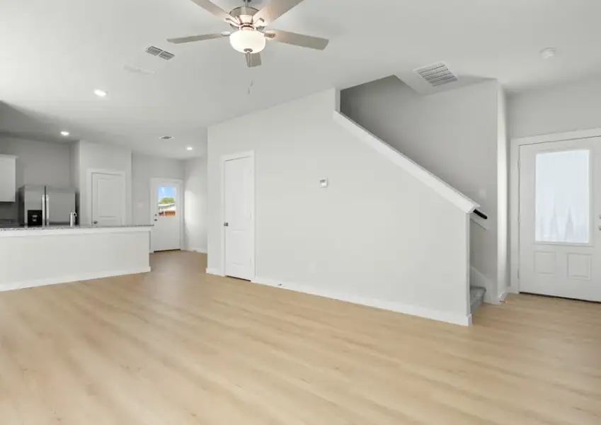 Open floor plan connects the living, dining and kitchen areas.