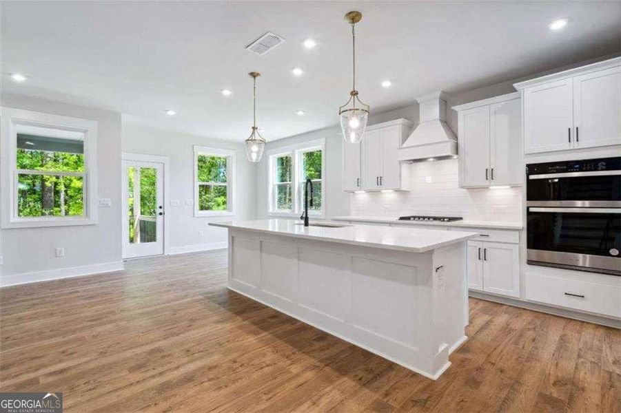 Furnished interior view inside a new home in The Paddocks at Doc Hughes, Buford (Image 4).