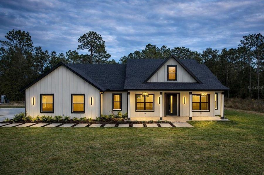 Front exterior of a new home in , Dunnellon, FL, highlighting curb appeal (Image 25).