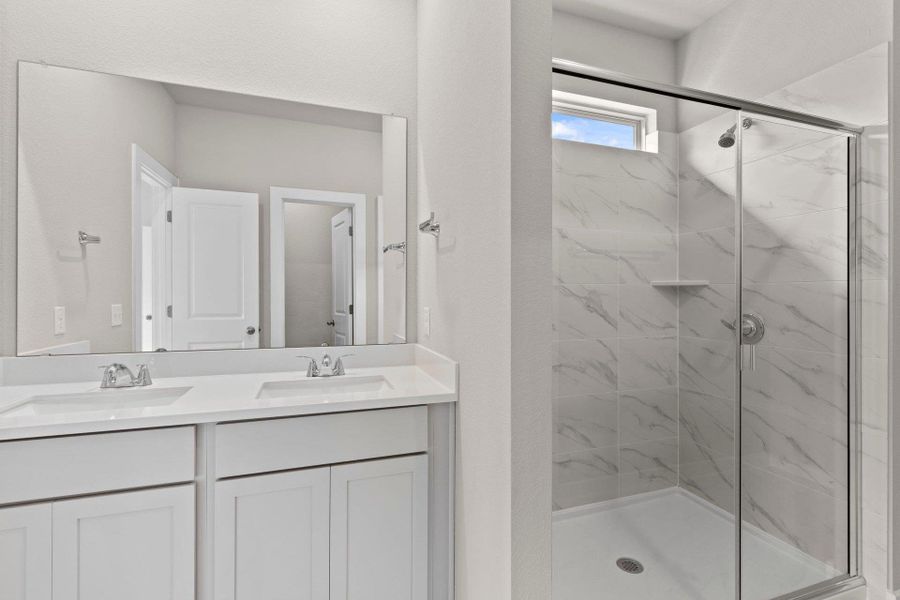 Primary Bath retreat with dual vanities & walk-in shower