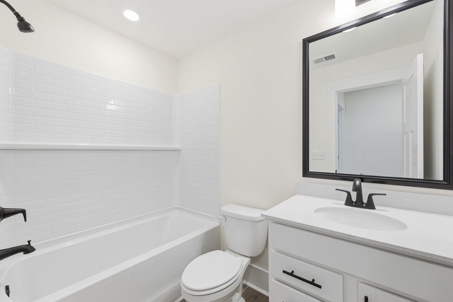 Representative furnished interior of a home built from the Montague II by Great Southern Homes in Oak Hollow, Longs (Image 10).