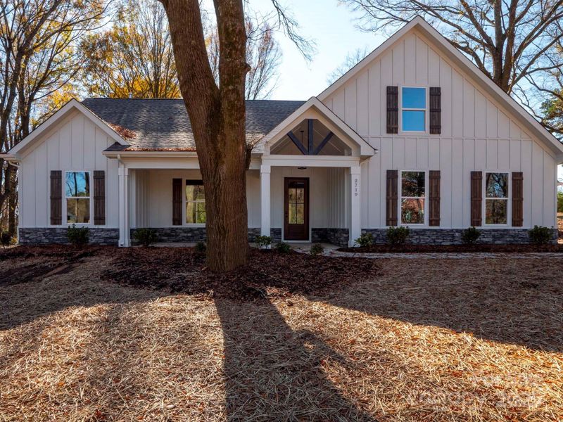 Front exterior of a new home in , Monroe, NC, highlighting curb appeal (Image 23). Front exterior of a new home in , Monroe, NC, highlighting curb appeal (Image 23).
